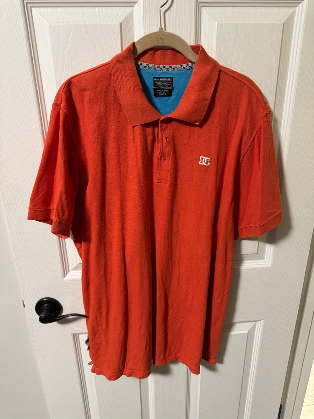 DC Men's Bright Orange Polo with Subtle Chest Logo